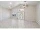 Living space with high ceilings, tile floors, large windows, and a ceiling fan at 20626 N 55Th Ave, Glendale, AZ 85308