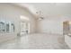 Bright living area with large windows, plantation shutters, and neutral tile flooring at 20626 N 55Th Ave, Glendale, AZ 85308