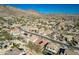 Serene aerial perspective of the community showcasing desert landscape, with houses and a backdrop of mountains at 27250 N 86Th Ave, Peoria, AZ 85383