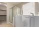 The bathroom features a walk in shower and handicap bar at 27250 N 86Th Ave, Peoria, AZ 85383
