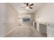 The bedroom has carpeted floors, neutral walls, a ceiling fan, and built in desk area at 27250 N 86Th Ave, Peoria, AZ 85383