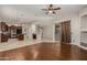 Inviting living space flows into kitchen with hardwood floors and access to the patio at 27250 N 86Th Ave, Peoria, AZ 85383