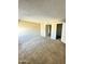 Comfortable carpeted bedroom offers abundant natural light and closet access at 2938 N 61St Pl # 234, Scottsdale, AZ 85251