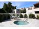 Inviting community hot tub with a charming patio setting and privacy landscaping at 2938 N 61St Pl # 234, Scottsdale, AZ 85251