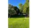 Well-maintained green lawn with mature trees, providing a serene outdoor space at 2938 N 61St Pl # 234, Scottsdale, AZ 85251