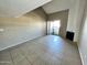 Bright living room with fireplace, sliding glass doors to patio, and neutral-toned flooring at 2938 N 61St Pl # 234, Scottsdale, AZ 85251