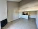 Open concept living space featuring a fireplace and adjacent kitchen area at 2938 N 61St Pl # 234, Scottsdale, AZ 85251