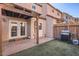Backyard featuring artificial turf, a BBQ grill, and convenient access to the house at 4525 E Rhonda Dr, Phoenix, AZ 85018