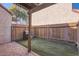 Private backyard with artificial turf and a BBQ grill, perfect for outdoor living at 4525 E Rhonda Dr, Phoenix, AZ 85018
