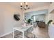 Cozy dining area featuring a stylish chandelier and seating for four with natural light at 4525 E Rhonda Dr, Phoenix, AZ 85018