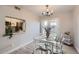 Cozy dining area featuring a stylish chandelier and seating for four with natural light at 4525 E Rhonda Dr, Phoenix, AZ 85018