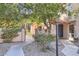 Cozy courtyard entrance with iron gate, desert landscaping, and a tranquil, welcoming path at 4525 E Rhonda Dr, Phoenix, AZ 85018