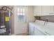 Practical laundry room with washer, dryer, and convenient access to the outside at 4525 E Rhonda Dr, Phoenix, AZ 85018