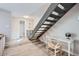Bright living room with a staircase, study space, wooden floors and stylish decor at 4525 E Rhonda Dr, Phoenix, AZ 85018