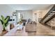 Bright living room with a comfortable sectional sofa, wooden floors and stylish decor at 4525 E Rhonda Dr, Phoenix, AZ 85018