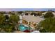 Aerial view of a home with an in-ground pool, covered patio and well-manicured landscaping at 4914 N Valley Gln, Litchfield Park, AZ 85340