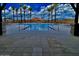 A beautiful view of the community pool area framed by architectural pillars and desert landscape at 5749 E Sierra Morena St, Mesa, AZ 85215