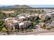 Aerial view of the condo complex featuring multiple units, and desert landscaping at 6166 N Scottsdale Rd # A3001, Paradise Valley, AZ 85253