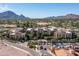 Aerial view of the complex featuring multiple units, well-kept landscaping and desert scenery at 6166 N Scottsdale Rd # A3001, Paradise Valley, AZ 85253