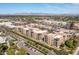 Aerial view of the community nestled among shops, desert landscaping and mountain views at 6166 N Scottsdale Rd # A3001, Paradise Valley, AZ 85253