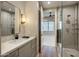 This bathroom features tiled shower, quartz counters and opens to Primary bedroom for easy access at 6166 N Scottsdale Rd # A3001, Paradise Valley, AZ 85253