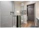 Elegant bathroom featuring glass shower with tile surround, modern vanity, and custom closet at 6166 N Scottsdale Rd # A3001, Paradise Valley, AZ 85253