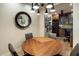 This dining area has wood floors, a round table, and a modern chandelier at 6166 N Scottsdale Rd # A3001, Paradise Valley, AZ 85253