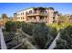 Stunning exterior view of the multi-story building, showcasing beautifully landscaped gardens at 6166 N Scottsdale Rd # A3001, Paradise Valley, AZ 85253