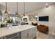 Open-concept kitchen and living area with large island and modern finishes at 6166 N Scottsdale Rd # A3001, Paradise Valley, AZ 85253