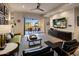 Bright living room with balcony, hardwood floors, and modern furnishings at 6166 N Scottsdale Rd # A3001, Paradise Valley, AZ 85253