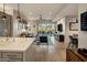 Spacious living room featuring hardwood floors, a balcony, and an open floor plan at 6166 N Scottsdale Rd # A3001, Paradise Valley, AZ 85253