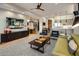 Open-concept living area features a modern design, hardwood flooring, and contemporary furnishings at 6166 N Scottsdale Rd # A3001, Paradise Valley, AZ 85253