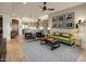 Spacious living area showcasing an open floor plan with a modern kitchen and stylish furnishings at 6166 N Scottsdale Rd # A3001, Paradise Valley, AZ 85253