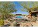 Community pool area with lounge seating under a shaded structure at 727 E Monte Way, Phoenix, AZ 85042