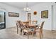 A formal dining room includes a wooden table, neutral chairs, and artwork at 727 E Monte Way, Phoenix, AZ 85042