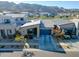 Stunning home showcasing desert landscaping, a blue garage door, and mountain views in the background at 727 E Monte Way, Phoenix, AZ 85042