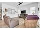 A bright living room features tile floors, a ceiling fan, and comfortable seating at 727 E Monte Way, Phoenix, AZ 85042