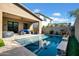 Sparkling pool with a covered patio and comfortable seating area at 727 E Monte Way, Phoenix, AZ 85042