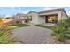 Charming backyard featuring gravel landscaping, artificial turf, and a covered patio at 9624 E Twinkle Cir, Mesa, AZ 85212