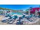 Stunning community pool area with waterslides, umbrellas, and plenty of seating for residents to enjoy at 9624 E Twinkle Cir, Mesa, AZ 85212