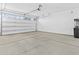 Spacious two car garage with a garage door, concrete floors and walls at 9624 E Twinkle Cir, Mesa, AZ 85212