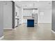 Modern kitchen with white cabinetry, stainless steel appliances, and stylish island at 9624 E Twinkle Cir, Mesa, AZ 85212
