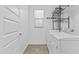 Laundry room features a tile floor, shelving and newer washer and dryer at 9624 E Twinkle Cir, Mesa, AZ 85212