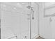 Modern glass-enclosed shower with white subway tiles and a rainfall showerhead at 9624 E Twinkle Cir, Mesa, AZ 85212