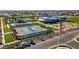Aerial view of tennis courts, clubhouse and ample parking at 9624 E Twinkle Cir, Mesa, AZ 85212