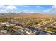 Scenic aerial view of a lovely community surrounded by majestic mountains, highlighting the home's desirable location at 12218 N 104Th St, Scottsdale, AZ 85260