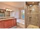 This luxurious bathroom includes a double vanity, shower, tub, and stylish tile at 1263 N Blackstone Dr, Chandler, AZ 85224