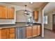 Functional kitchen featuring stainless steel appliances and stone countertops at 1263 N Blackstone Dr, Chandler, AZ 85224