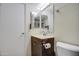 Small bathroom with wood vanity and traditional fixtures at 13408 N 25Th Dr, Phoenix, AZ 85029