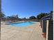 Relaxing community pool surrounded by concrete and landscaping at 13408 N 25Th Dr, Phoenix, AZ 85029